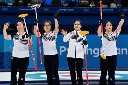 FILE PHOTO: Curling - Pyeongchang 2018 Winter Olympics - Women’s Round Robin - Sweden v South Korea - Gangneung Curling Center - Gangneung, South Korea - February 19, 2018 - Kim Eun-jung, Kim Kyeong-ae, Kim Seon-yeong and Kim Yeong-mi of South Korea celebrate beating Sweden. REUTERS/Toby Melville/File Photo