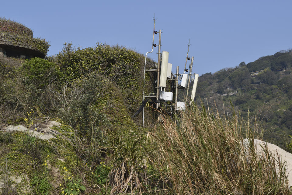 Telecom equipment are seen on top of a hill in Beigan, part of Matsu Islands, Taiwan on Sunday, March 5, 2023. Thousands of residents of Taiwan's outlying islands near the Chinese coast have been without the internet for the past month. Chunghwa Telecom, Taiwan's largest service provider and owner of the two submarines cables that serve Matsu islands, says Chinese vessels cut them. (AP Photo/Huizhong Wu)