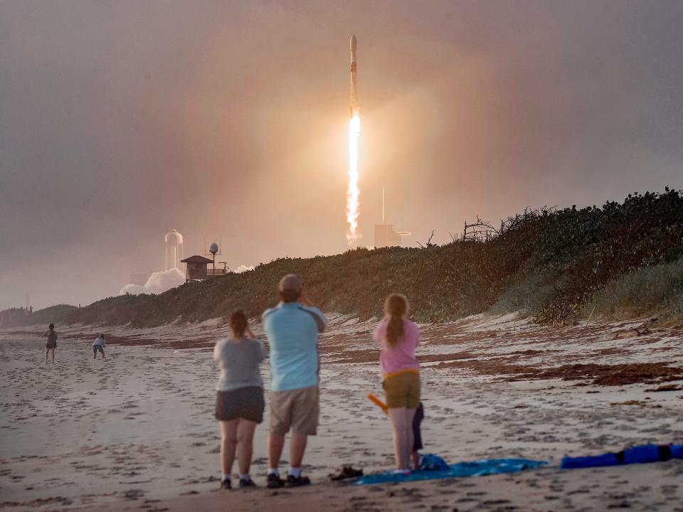 spacex falcon 9 rocket launch starlink internet satellites 13th mission cape canaveral florida beach family GettyImages 1228923231 edit