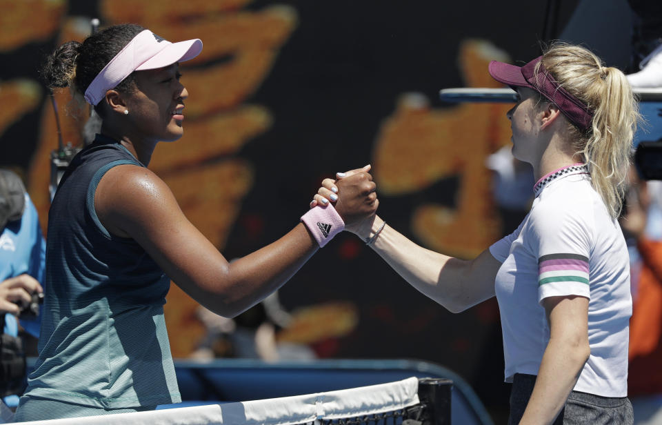 Japan's Naomi Osaka, left, is congratulated by Ukraine's Elina Svitolina after winning their quarterfinal match at the Australian Open tennis championships in Melbourne, Australia, Wednesday, Jan. 23, 2019. (AP Photo/Kin Cheung)