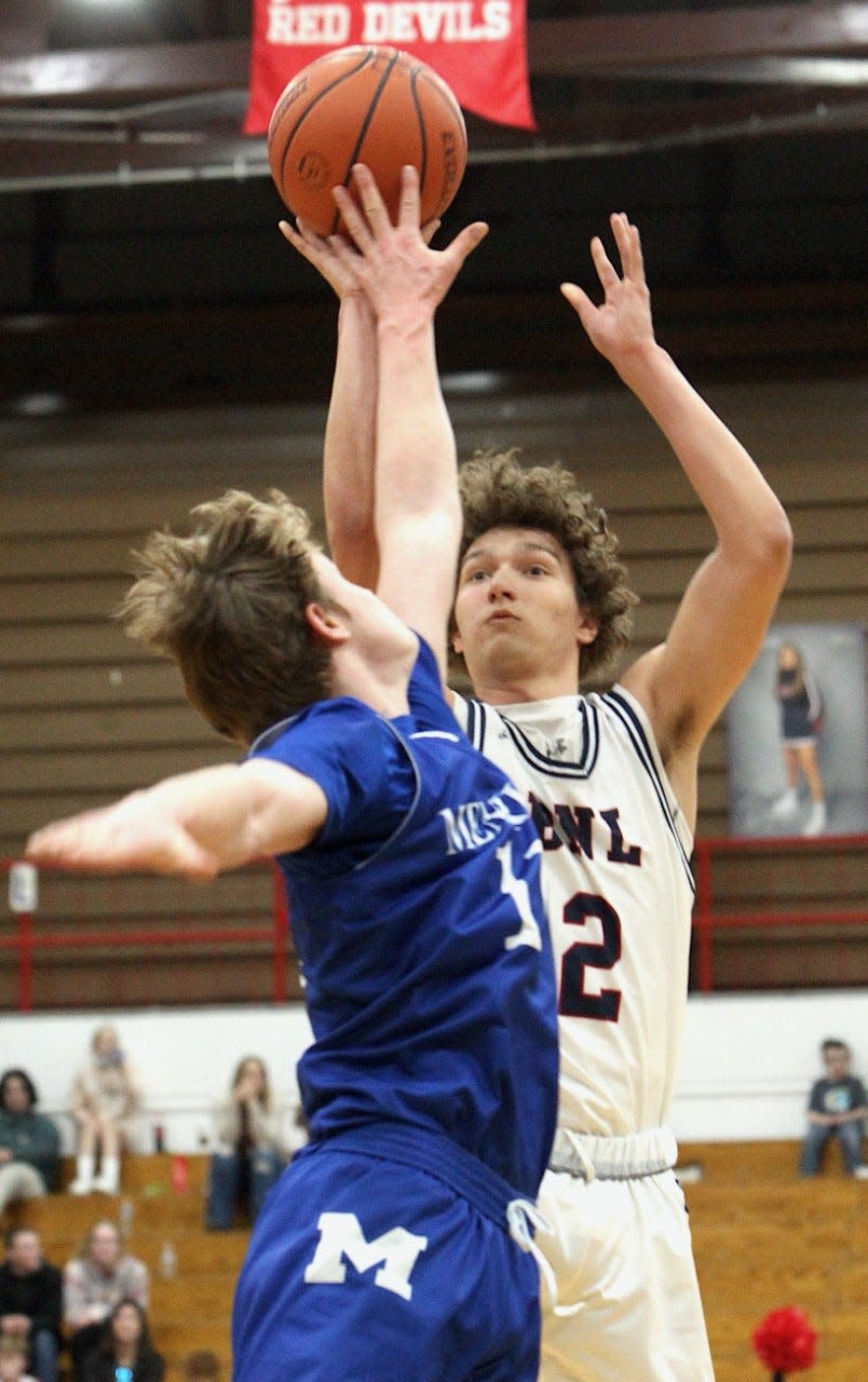 BNL guard Colten Leach launches a short-range jump shot over an Evansville Memorial defender Saturday during a 54-52 win for the Stars.