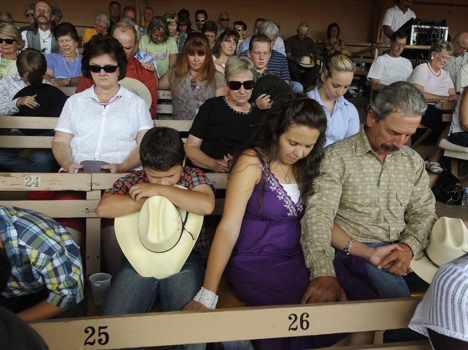 The Church at the Ranch holds its services on Sunday, July 1, 2012, at the Penrose Norris Event Center in Colorado Springs, Colo. It would normally hold services at Flying W Ranch, but their place of worship burned down in the Waldo Canyon fire. So far, the blaze, now 45 percent contained, has damaged or destroyed nearly 350 homes. (AP Photo/The Colorado Springs Gazette, Jerilee Bennett)