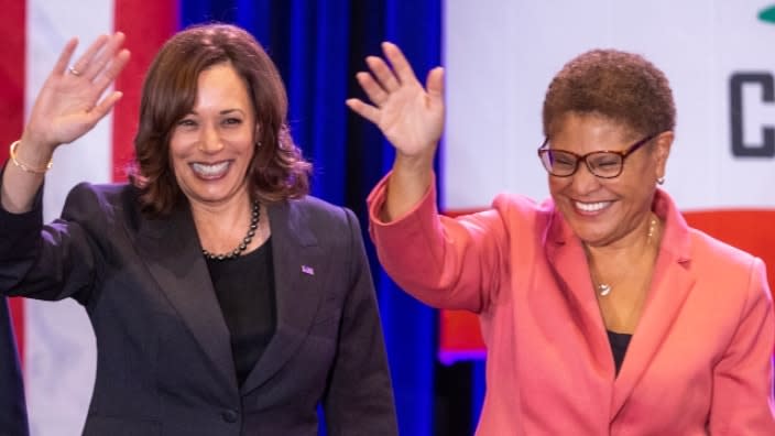 At a get-out-the-vote event on the campus of UCLA on Nov. 7, the eve of Election Day, Vice President Kamala Harris (left) and Rep. Karen Bass (right), a mayoral candidate at the time who went on to victory, wave to attendees from onstage. Harris will swear in Bass this weekend. (Photo: David McNew/Getty Images)