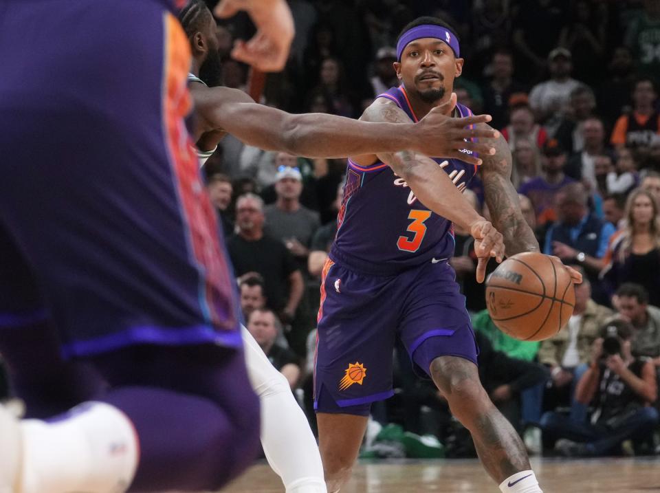 Mar 9, 2024; Phoenix, Ariz, U.S.; Phoenix Suns guard Bradley Beal (3) passes the ball into the lane against the Boston Celtics at Footprint Center.