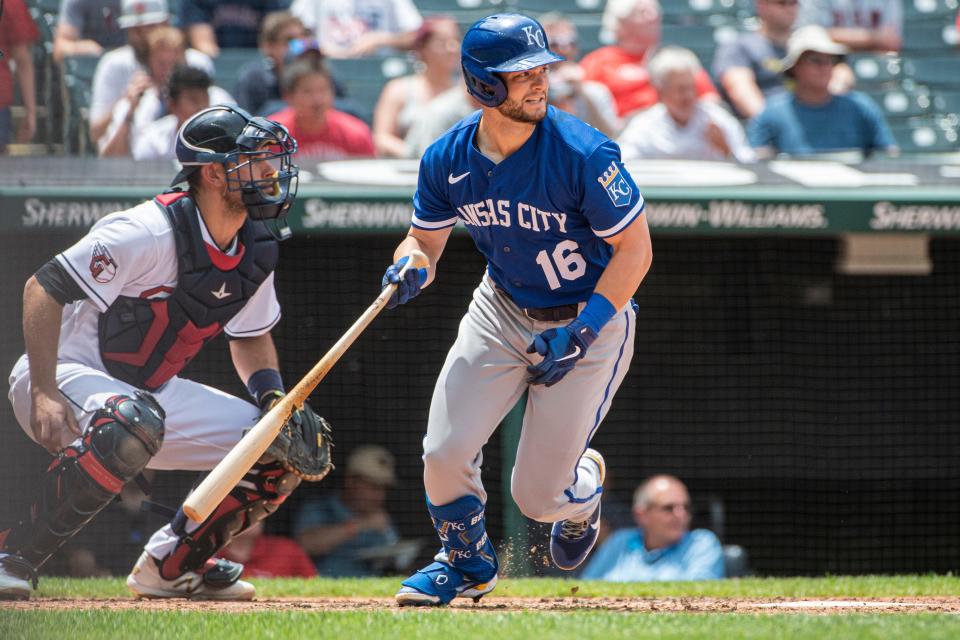 Andrew Benintendi watches his hit for the Royals with Guardians catcher Luke Maile during the third inning Wednesday in Cleveland.