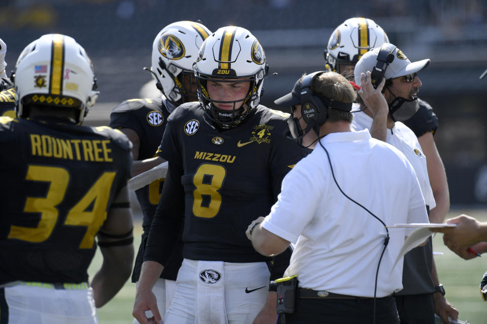 Missouri head coach Eliah Drinkwitz talks with quarterback Connor Bazelak (8) during the second half of an NCAA college football game against LSU Saturday, Oct. 10, 2020, in Columbia, Mo. (AP Photo/L.G. Patterson)