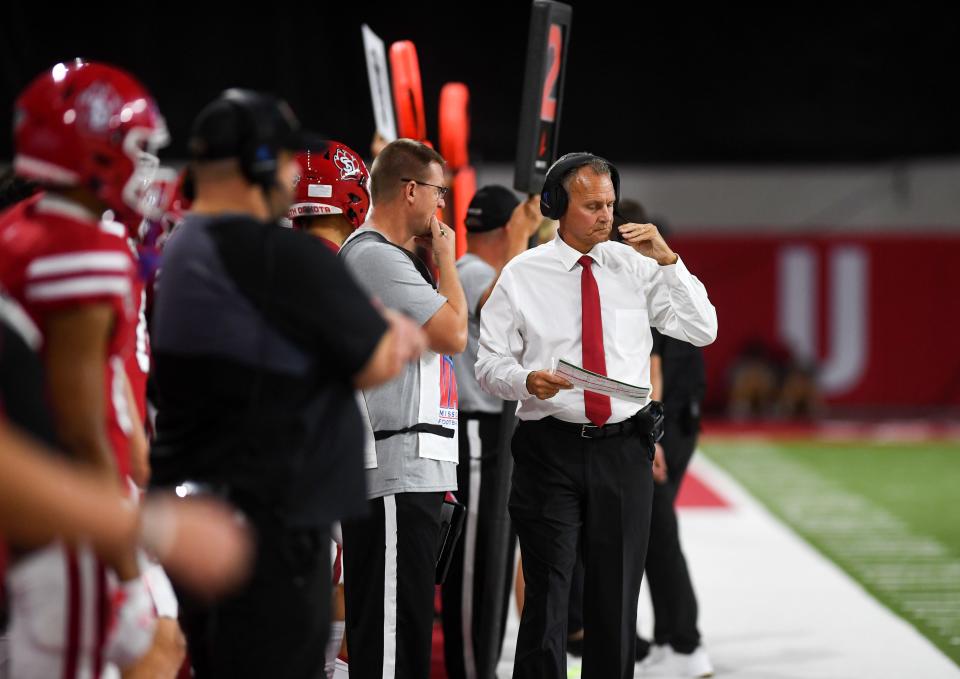 University of South Dakota head coach Bob Nielsen wears a headset on the sidelines during a football game on Saturday, September 17, 2022, at the DakotaDome in Vermillion. 