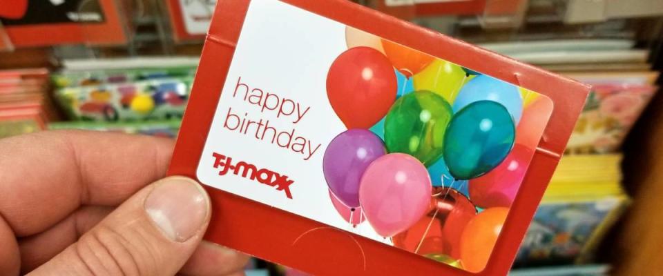 PLATTSBURGH, USA - SEPTEMBER 10, 2018: A man holding TJ Maxx gift card.