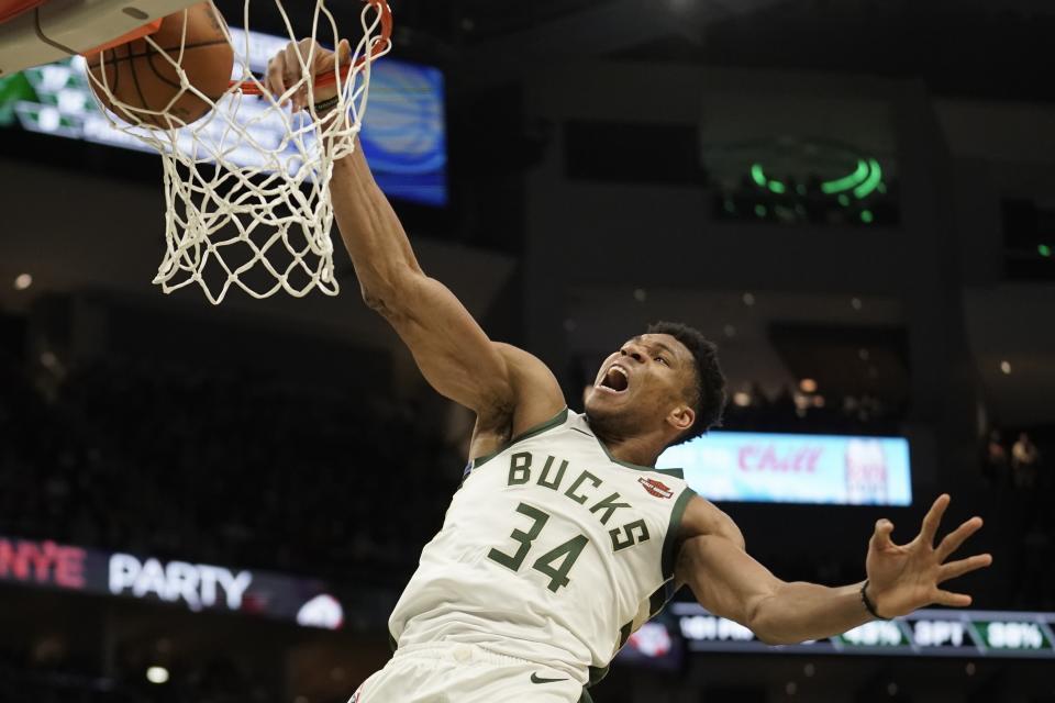Milwaukee Bucks' Giannis Antetokounmpo dunks during the second half of an NBA basketball game against the Indiana Pacers Sunday, Dec. 22, 2019, in Milwaukee. The Bucks won 117-89. (AP Photo/Morry Gash)