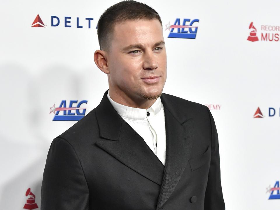 Channing wears a white button down and black blazer