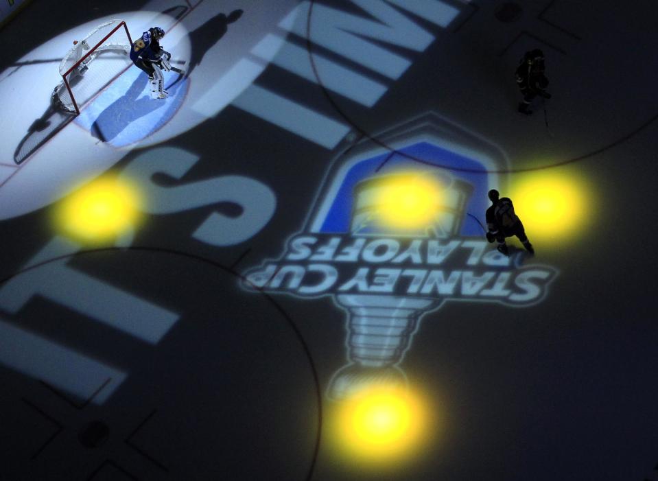 St. Louis Blues goalie Ryan Miller, left, and teammate David Backes prepare fore Game 1 of a first-round NHL hockey Stanley Cup playoff series against the Chicago Blackhawks on Thursday, April 17, 2014, in St. Louis. (AP Photo/Jeff Roberson)