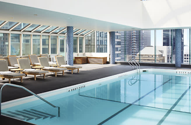 <p><strong>Where: </strong>New York City</p> <p>Welcome to Caribbean water temps right in the heart of Fifth Avenue. On the 42nd floor of is the glass-enclosed rooftop pool, where you can swim alongside views of Central Park and the skyline. A $100 day pass gives access to the pool as well as its whimsically designed 20,000-square-foot health and fitness center located underground. This veritable playground for adults contains a gym, a restaurant, a manicure bar and the highlight: the hidden Moonshine spa, decked out with old barnwood, faux-fur throws, and a house pet--a canary in a cage.</p> <p><strong>Insider Tip:</strong> It’s easy to pick a treatment at spa. You have two choices: facial or massage. Every treatment is then tailored by your therapist for you.</p> <p><strong>Plan Your Trip: </strong>Visit </p>