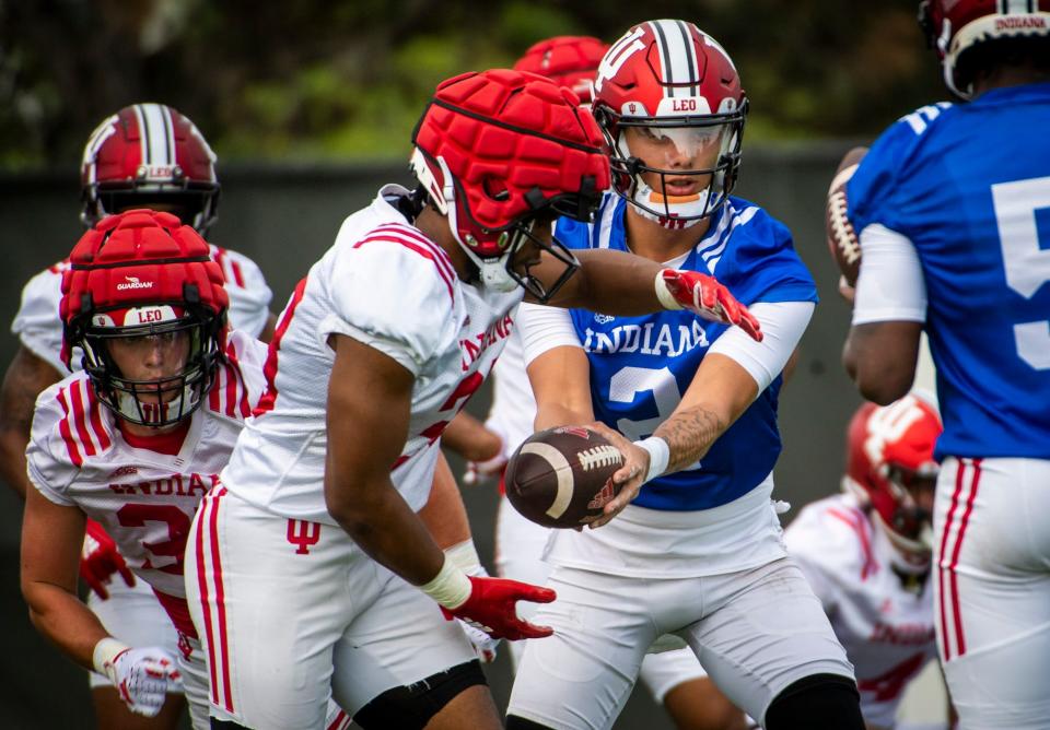 Indiana’s Tayven Jackson (2) hands the ball off to Christian Turner (28) during a drill during the first day of fall camp for Indiana football at their practice facilities on Wednesday, Aug. 2, 2023. Credit: Rich Janzaruk/Herald-Times-USA TODAY NETWORK