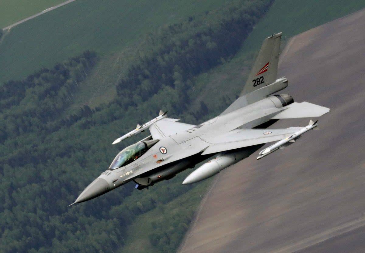 A Norwegian Air Force F-16 fighter patrols over the Baltics during a Nato air policing mission from Zokniai airbase near Siauliai (Reuters)