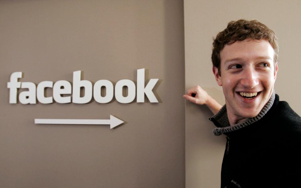 This Feb. 5, 2007 file photo shows Facebook.com founder Mark Zuckerberg smiling at Facebook headquarters in Palo Alto, Calif. On Feb. 4 - Paul Sakuma/AP