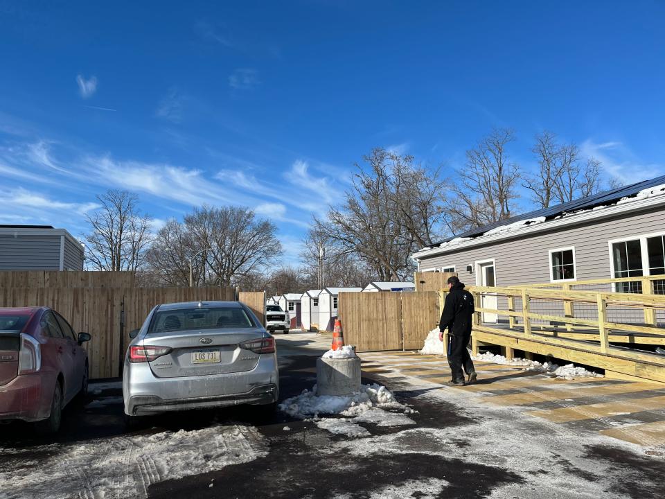 With the community building and bathhouse in place, the pod shelter on Elmwood Avenue finally opened after months of delay.