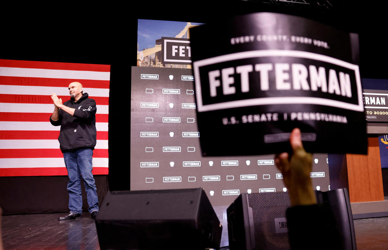 Fetterman reacts to his crowd of supporters on election night.