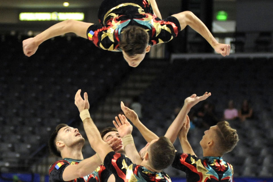 Members of the Romanian aerobic gymnastics team compete during The World Games in Birmingham, Ala., on Wednesday, July 13, 2022. (AP Photo/Jay Reeves)