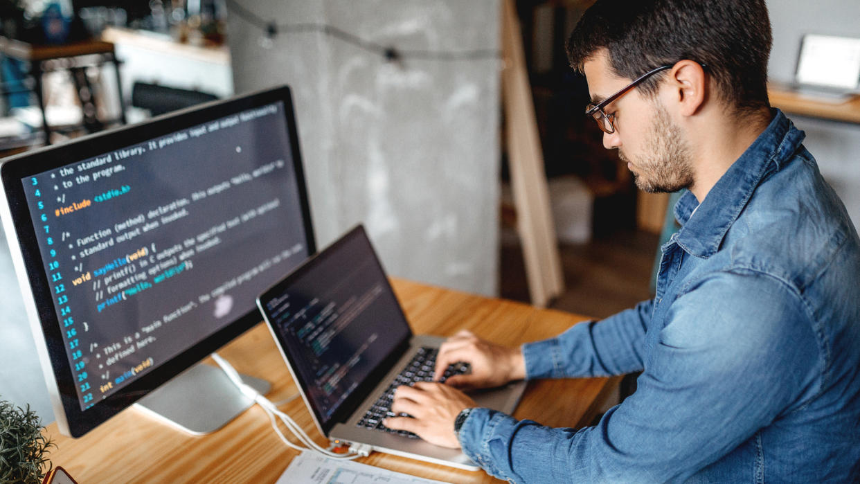  A laptop being used to write code - GettyImages-1221204650 