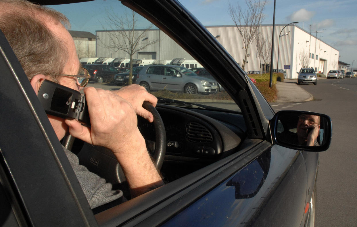 Drivers continue to use phones when they are driving . (PA)