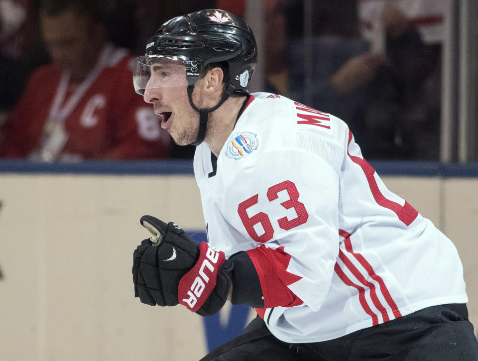 FILE - Canada's Brad Marchand (63) celebrates his goal against Europe during the third period of Game 2 of the World Cup of Hockey finals, in Toronto on Thursday, Sept. 29, 2016. A handful of NHL players are voicing frustration over the decision not to allow them to go to the upcoming Winter Olympics in Beijing. Marchand ripped the league and NHLPA on social media Tuesday, Dec. 28, 2021 for adding taxi squads to keep the season going but not in February to give players the option to leave for the Olympics. (Frank Gunn/The Canadian Press via AP, File)