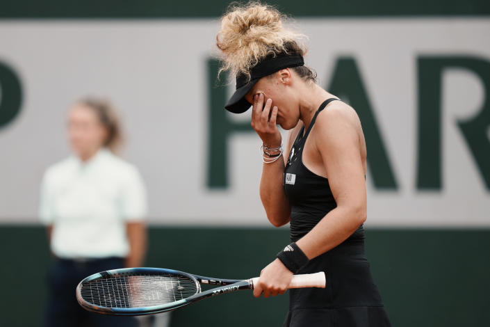 France's Leolia Jeanjean reacts after missing a shot against Romania's Irina-Camelia Begu during their third round match at the French Open tennis tournament in Roland Garros stadium in Paris, France, Saturday, May 28, 2022. (AP Photo/Thibault Camus)