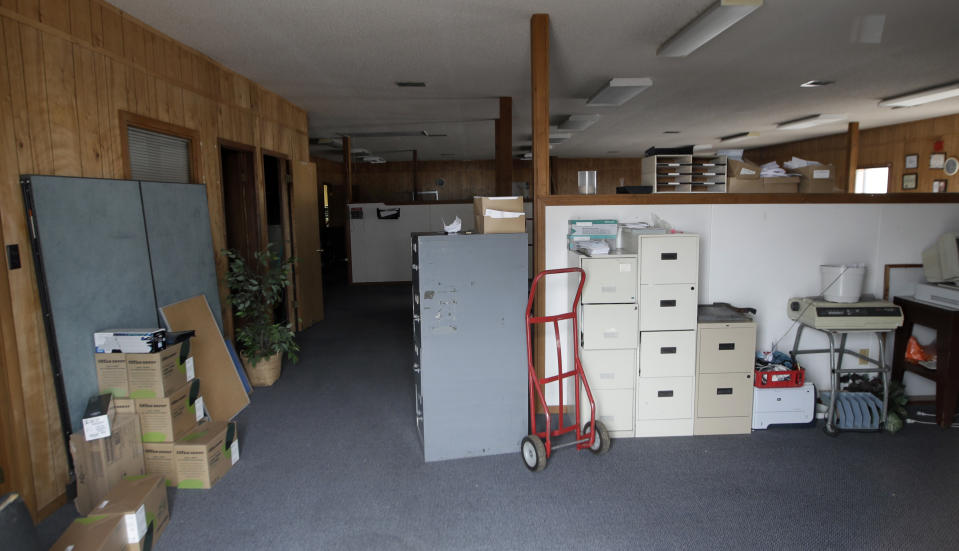 This Feb. 19, 2019 photo shows the empty front office and newsroom of the old Daily Guide newspaper in St Robert, Mo. (AP Photo/Orlin Wagner)