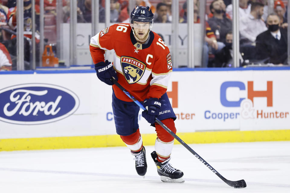 Florida Panthers center Aleksander Barkov (16) skates with the puck against the Arizona Coyotes during the second period of an NHL hockey game, Monday, Oct. 25, 2021, in Sunrise, Fla. (AP Photo/Michael Reaves)