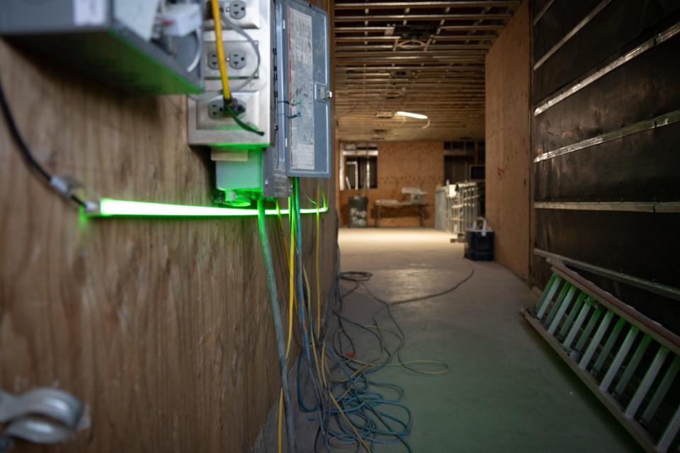 An image from Vidiots shows the ADA construction ramp lit with neon lights