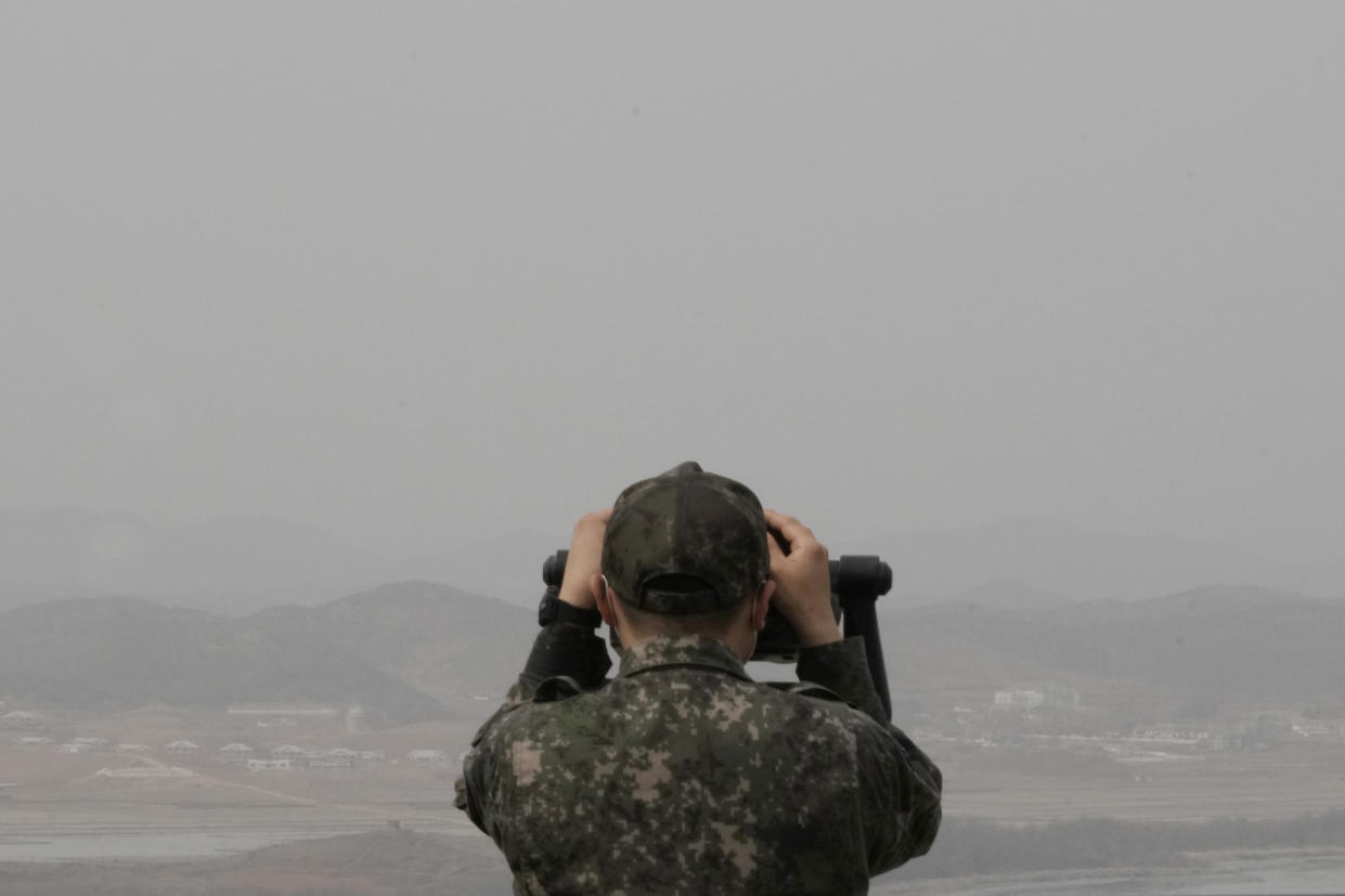 A South Korean army soldier watches the North Korea side from the Unification Observation Post in Paju, South Korea, near the border with North Korea, Friday, March 24, 2023. North Korea said Friday its cruise missile launches this week were part of nuclear attack simulations that also involved a detonation by a purported underwater drone as leader Kim Jong Un vowed to make his rivals &quot;plunge into despair.&quot; (AP Photo/Ahn Young-joon)