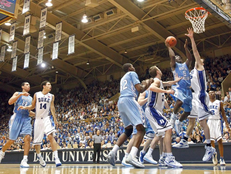 North Carolina's Ty Lawson (5) drives in for a basket as Duke's Brian Zoubek defends during the second  half of an NCAA college basketball game in Durham, N.C., Wednesday, Feb. 11, 2009. North Carolina won 101-87. 