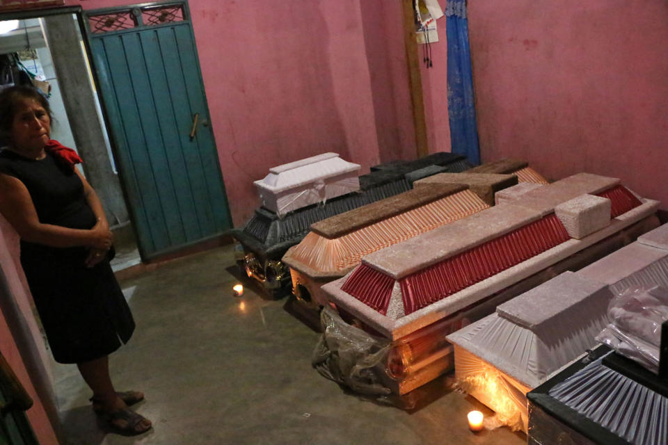 <p>TOPSHOT – A relative cries next to the victims’s coffins after a military helicopter fell on vehicles in Santiago Jamiltepec, Oaxaca state, Mexico, on Feb.17, 2018. (Photo: Patricia Castellanos/AFP/Getty Images) </p>