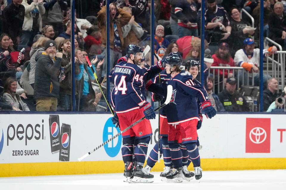 Mar 24, 2023; Columbus, Ohio, USA;  Columbus Blue Jackets center Kent Johnson (91) celebrates scoring a “Michigan goal” during the second period of the NHL hockey game against the New York Islanders at Nationwide Arena. Mandatory Credit: Adam Cairns-The Columbus Dispatch