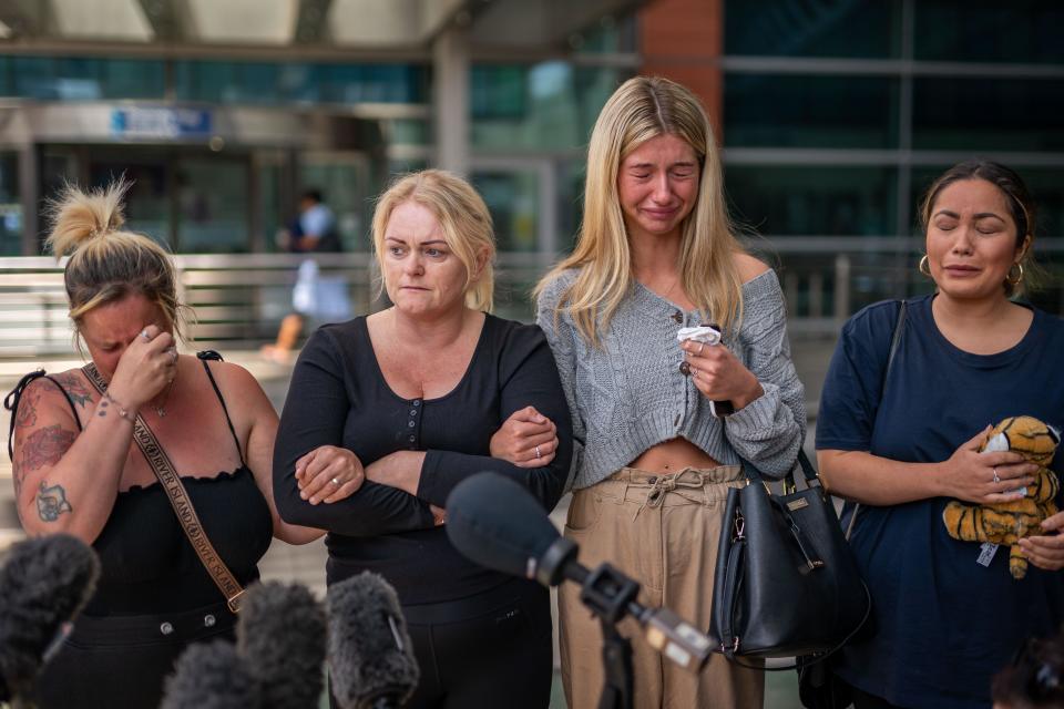 Hollie Dance, Archie's mum, on the second left, surrounded by family and friends, announcing the death of her son. (PA)