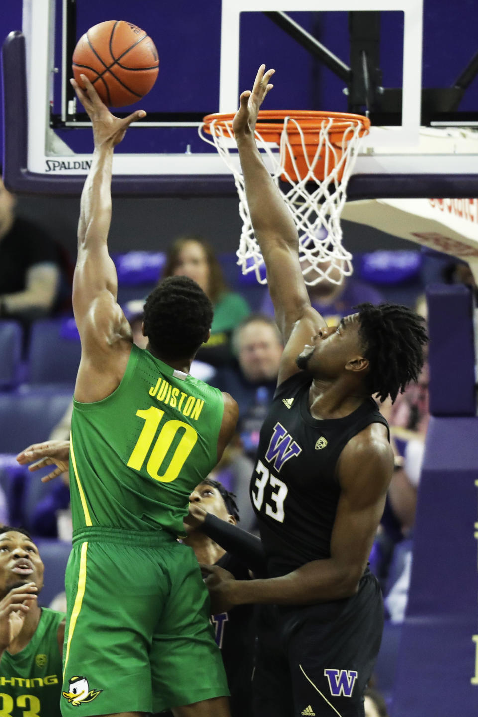 Washington forward Isaiah Stewart (33) tries to block a shot by Oregon forward Shakur Juiston (10) during the first half of an NCAA college basketball game, Saturday, Jan. 18, 2020, in Seattle. (AP Photo/Ted S. Warren)