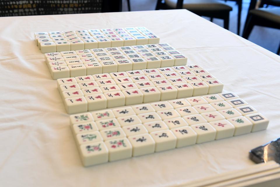 Mahjong tiles are lined up on a table as members of a mahjong club at the Grove active seniors community in Camarillo meet for a game day.