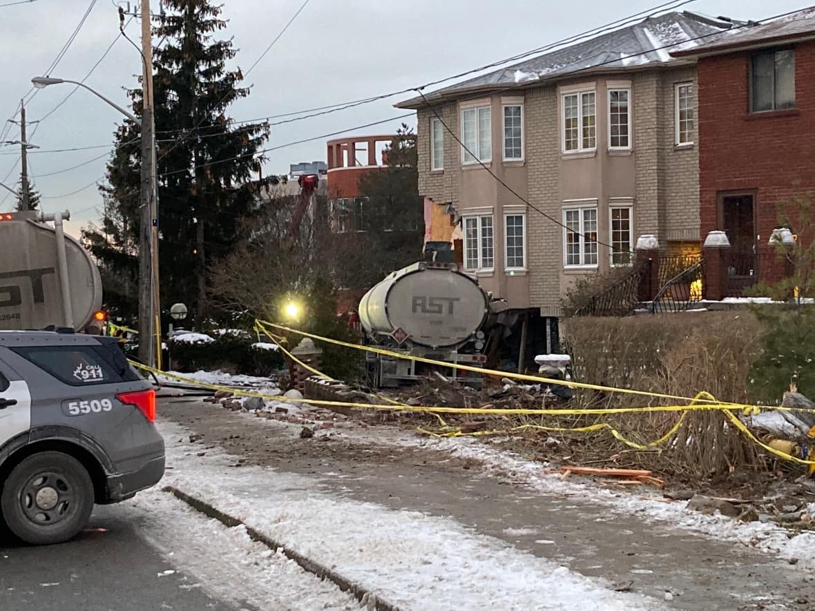 One person was inside the residence at the time of the crash, but was not injured, firefighters said. The truck driver sustained minor injuries. (Keith Burgess/CBC - image credit)