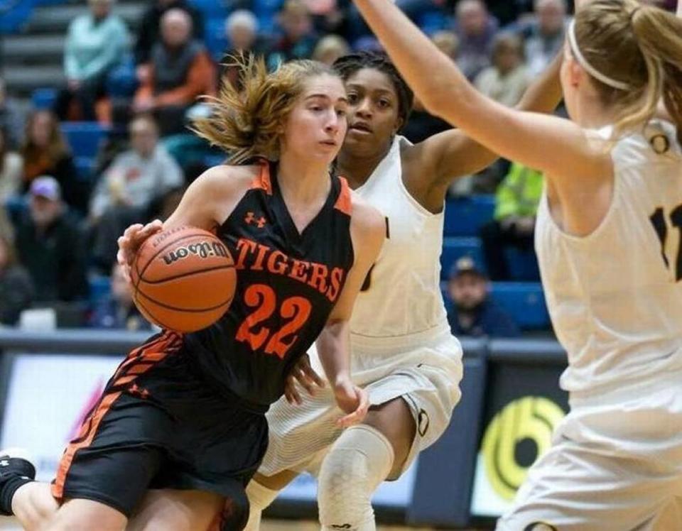 Edwardsville’s Kate Martin drives against O’Fallon’s Ashley Schloer in a Jan. 5 game at O’Fallon Township High School.