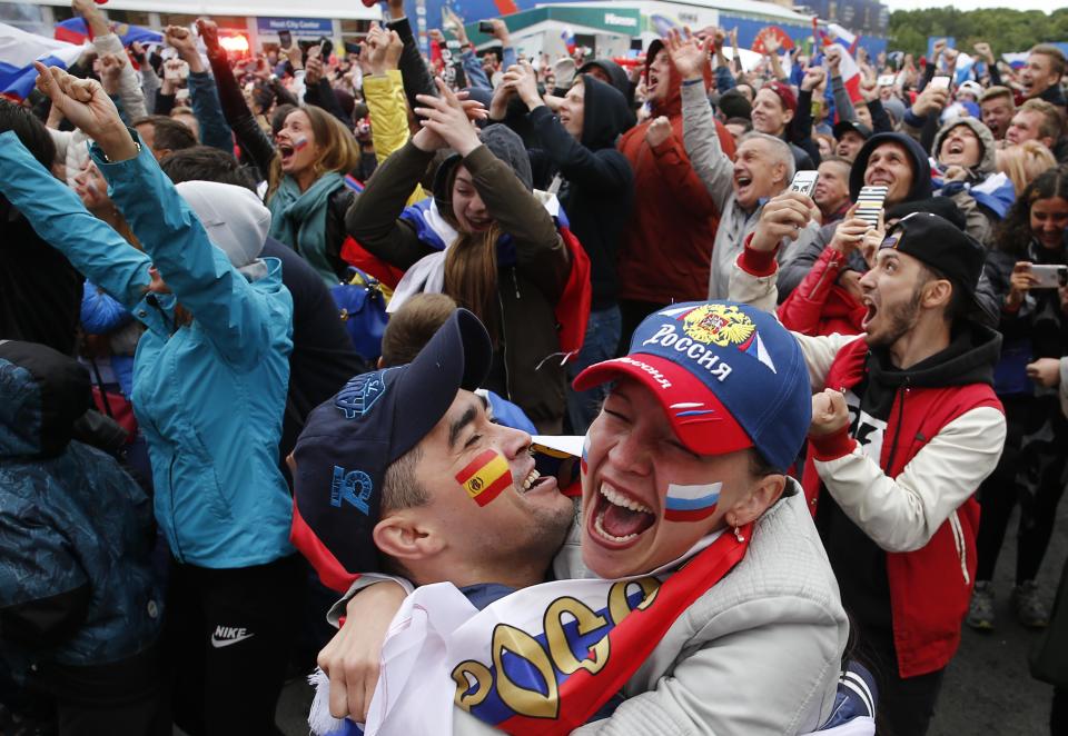 <p>Russian supporters celebrate a after Artem Dzyuba puts them level against Spain </p>
