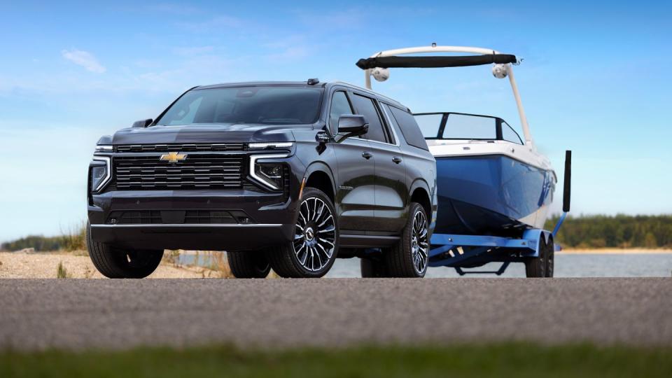 a 2025 chevrolet suburban towing a boat