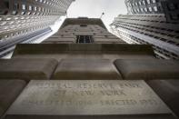 The corner stone of The New York Federal Reserve Bank is seen surrounded by financial institutions in New York's financial district March 25, 2015. REUTERS/Brendan McDermid