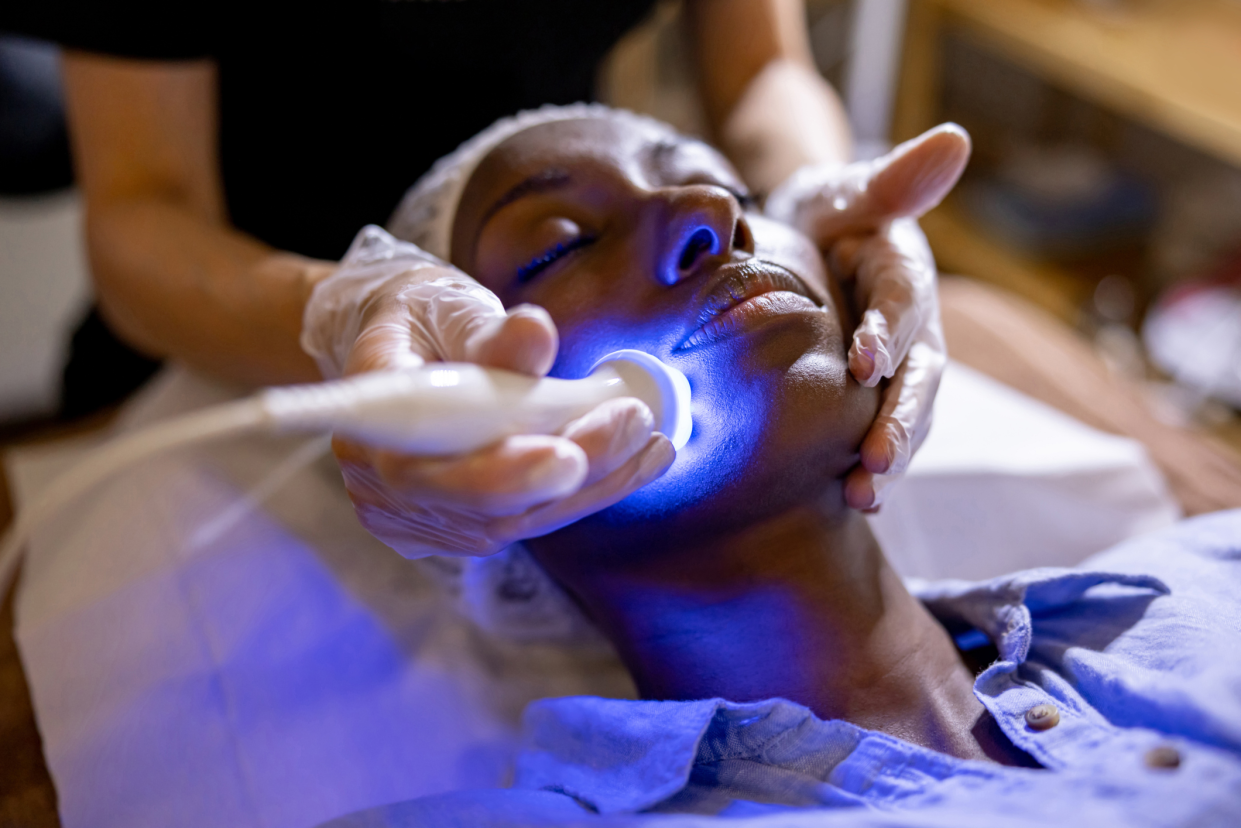 Closeup of Woman Laying Down Having a Laser Facial at a Dermatologist