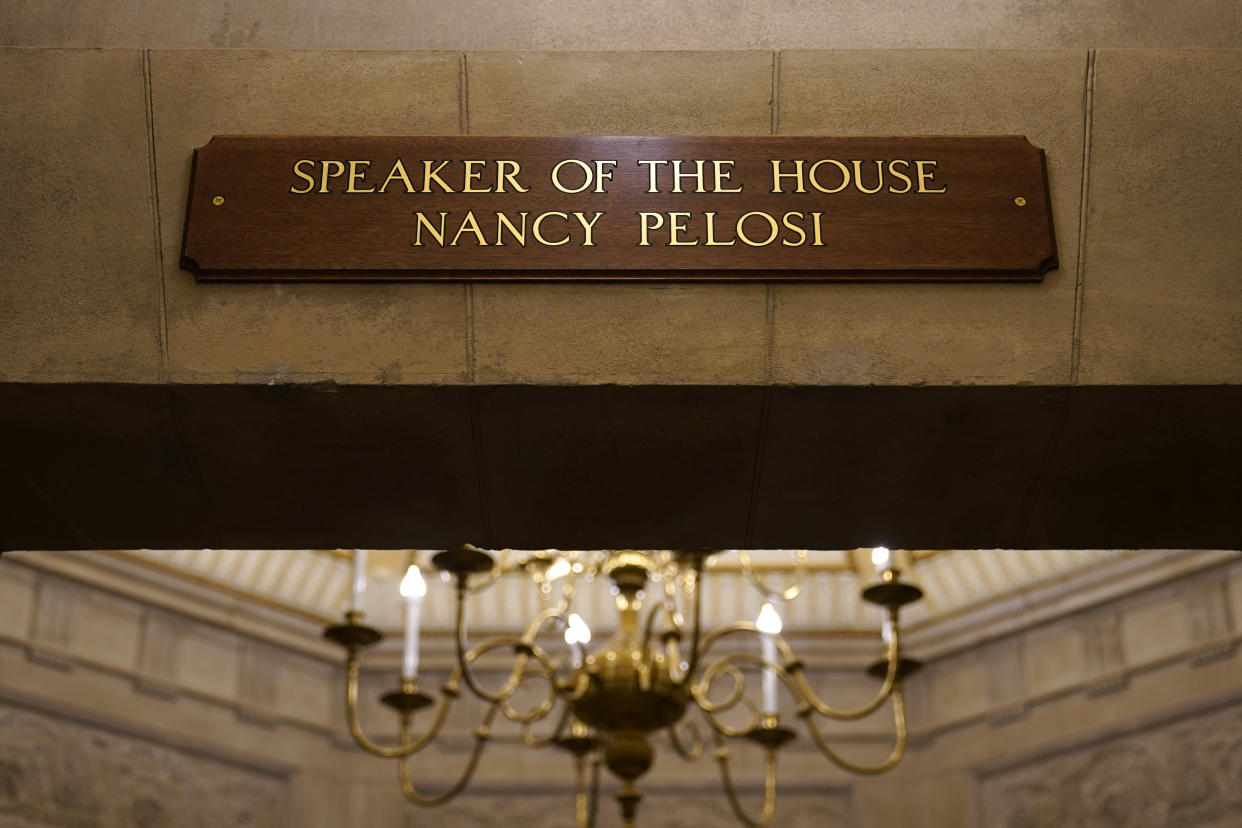 FILE - A view of the new sign marking the office for House Speaker Nancy Pelosi of Calif., from inside the U.S. Capitol in Washington, Jan. 18, 2021. The new sign replaces the one that was destroyed when rioters stormed the Capitol. (AP Photo/Susan Walsh, File)