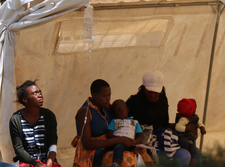 Patients await treatment at a makeshift cholera clinic in Harare, Zimbabwe, September 11, 2018. REUTERS/Philimon Bulawayo