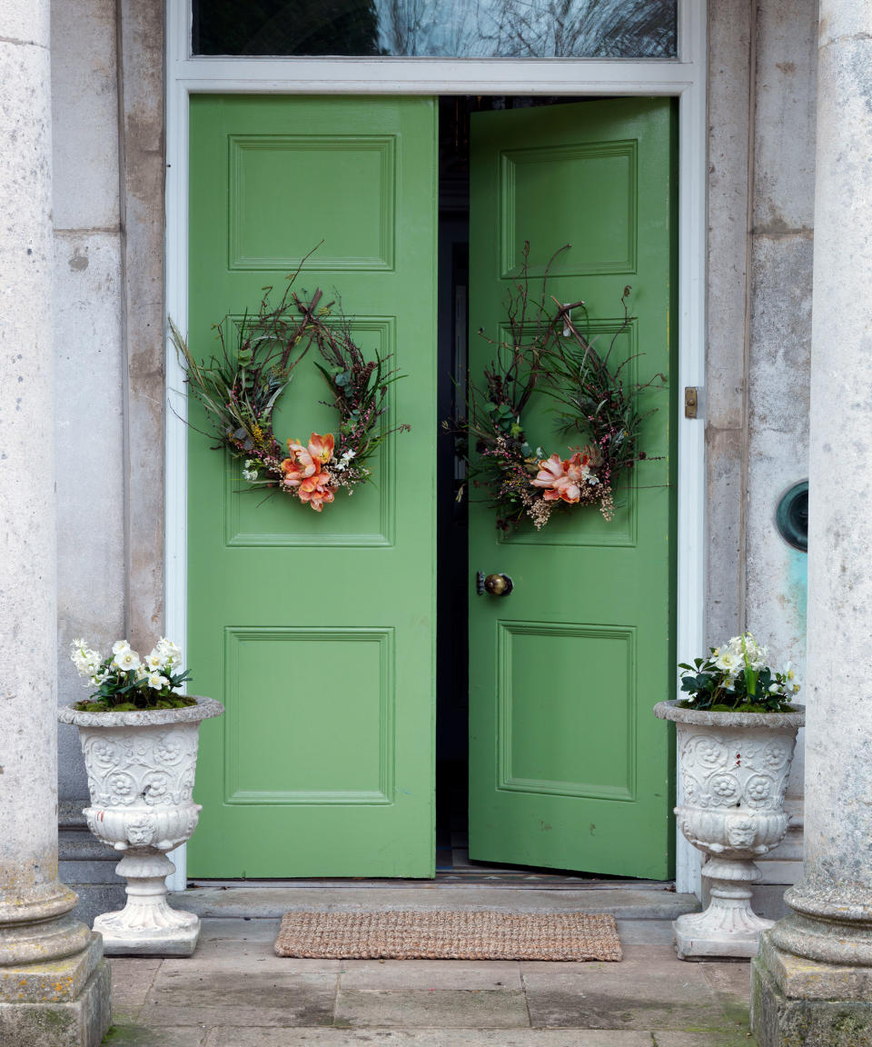 36. Decorate a front door with a wreath