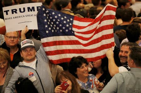 Supporters of Donald Trump celebrate after Trump was declared the winner of the Nevada Republican caucuses by the television networks, at his Nevada caucus night rally in Las Vegas. REUTERS/Jim Young