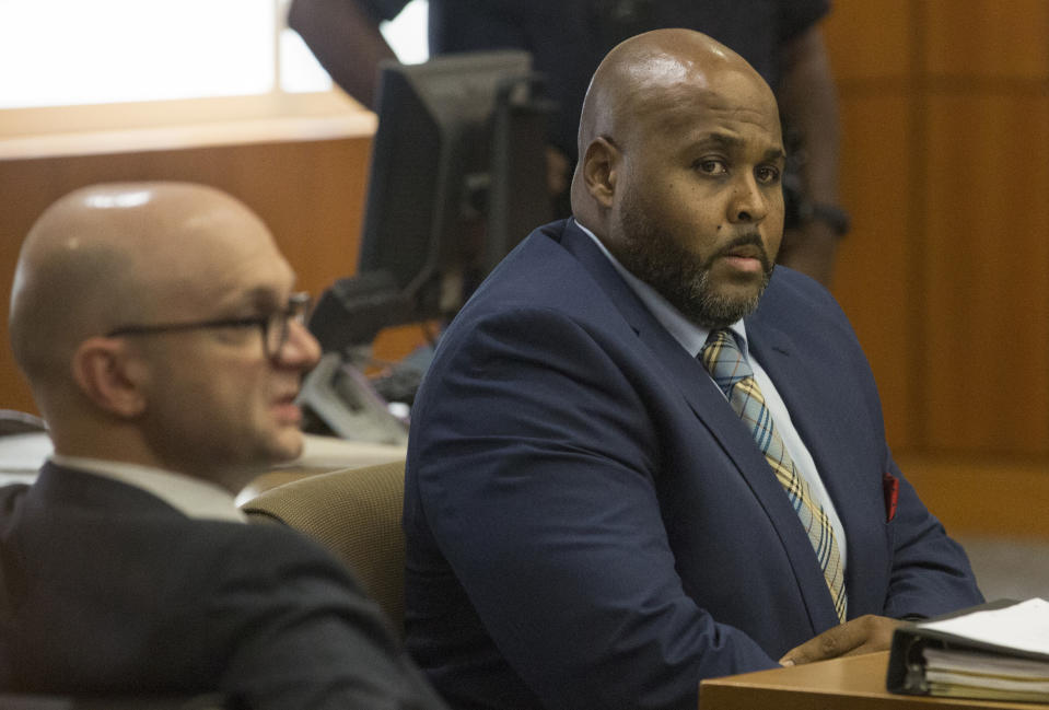 The trial for former Harris County Sheriff's Office Deputy Cameron Brewer, right, begins in State District Judge Josh Hill's courtroom at Harris County Civil Courthouse on Thursday, Aug. 1, 2019, in Houston. Brewer is charged with aggravated assault by a public servant for the death of Danny Ray Thomas in 2018. (Yi-Chin Lee/Houston Chronicle via AP)