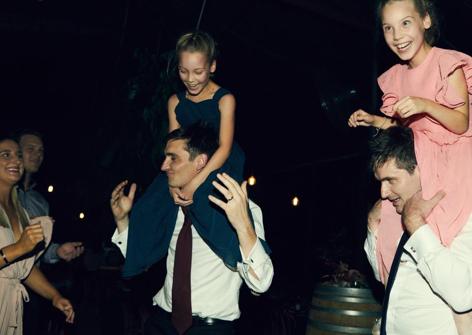 Michael is pictured here with his twin brother and their twin nieces on the dance floor—a really fun moment.