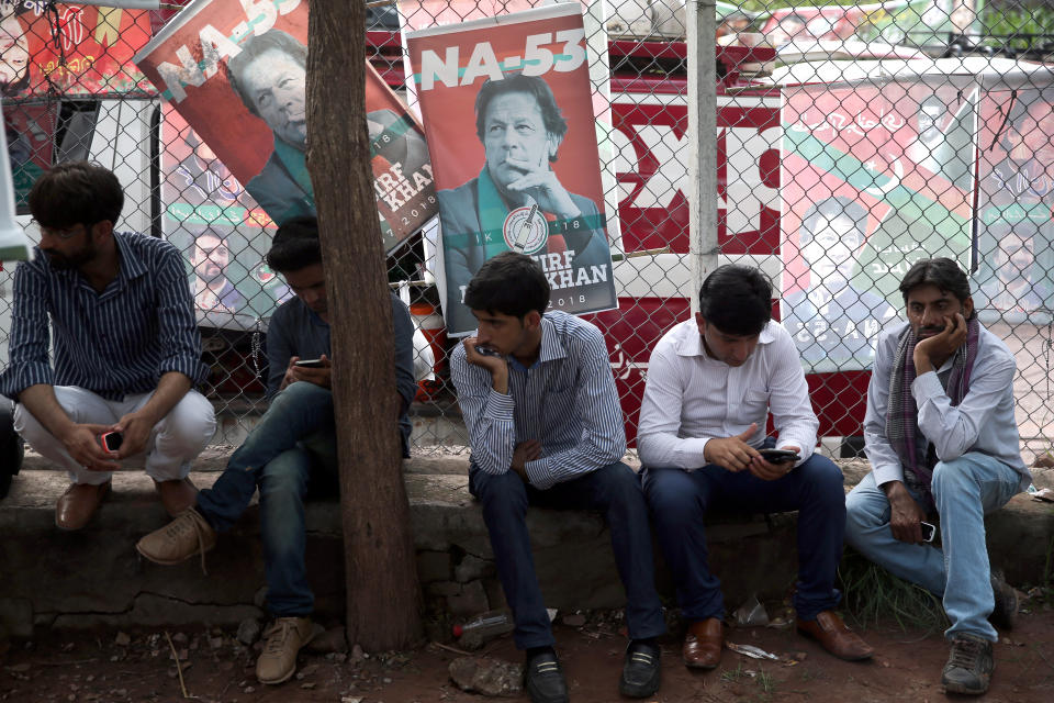 Supporters of cricket star-turned-politician Imran Khan, chairman of Pakistan Tehreek-e-Insaf (PTI), wait outside his residence, a day after the general election in Islamabad, Pakistan, July 26, 2018.