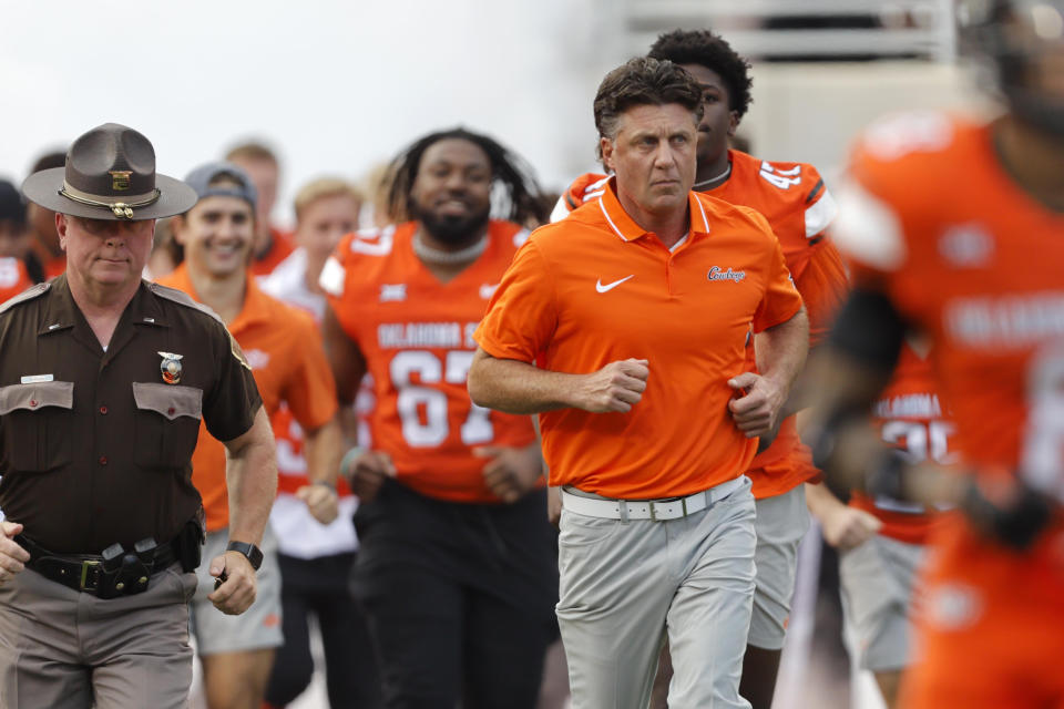 Sep 16, 2023; Stillwater, Oklahoma, USA; Oklahoma State coach Mike Gundy takes the field before an NCAA football game between Oklahoma State and South Alabama at Boone Pickens Stadium. South Alabama won 33-7. Mandatory Credit: Bryan Terry-USA TODAY Sports